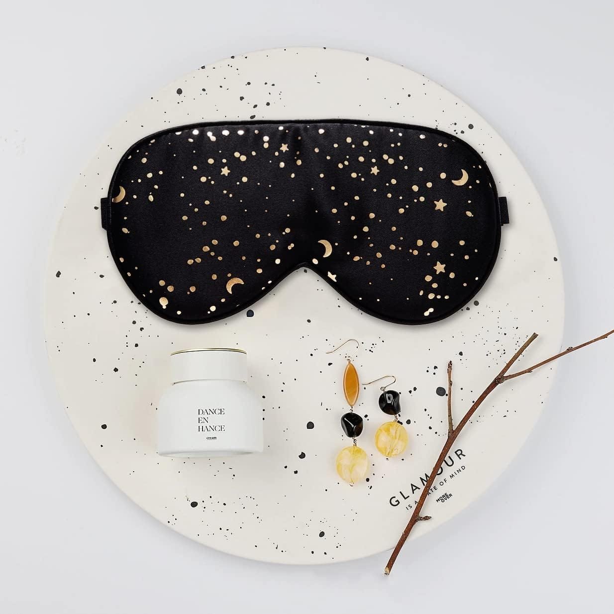 Eye mask with curved fit and back strap detail